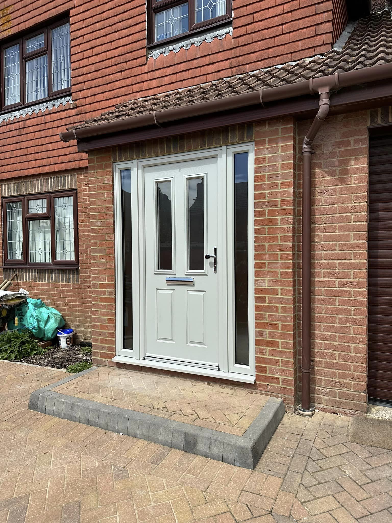 A lovely nee front door and sidelights